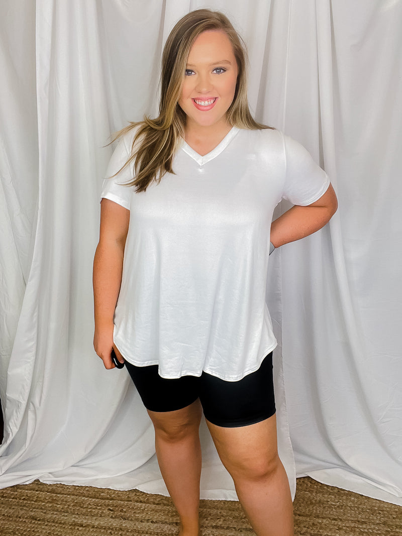 Top features a solid base color, butter fabric soft material, short sleeves, round neck line, and runs true to size!-white