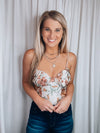 Bodysuit features an ivory base, multi colored floral print, sleeveless detail, spaghetti strap with adjustable detail, padded bra cup and runs true to size! 