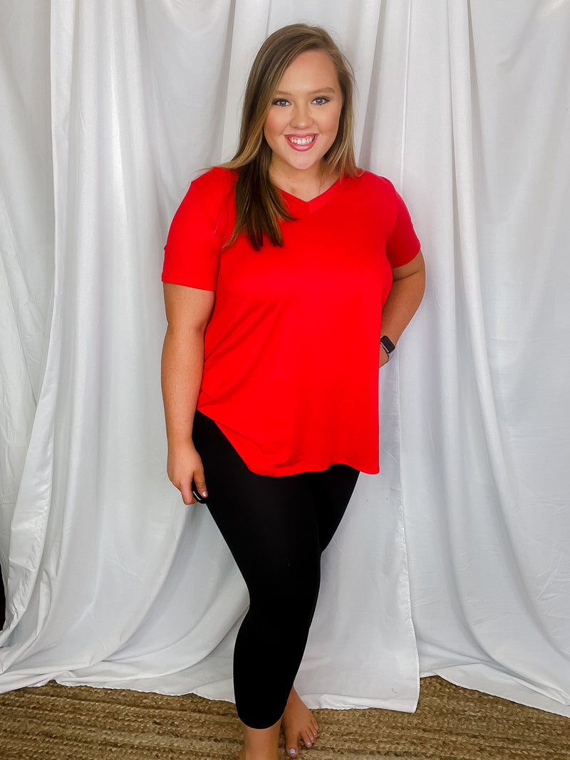 Top features a solid base color, butter fabric soft material, short sleeves, round neck line, and runs true to size!-red