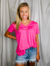 Top features a solid base color, butter fabric soft material, short sleeves, round neck line, and runs true to size!-pink
