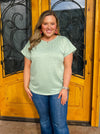 Bundles of Joy Top is a basic top designed with comfort and versatility in mind. It features a relaxed fit with cuffed sleeves and a round neckline in sage green with heather detailing. Perfect for any casual day or night. Try bundling it with jeans and sneakers for effortless style.