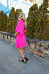 Dress features a stunning fuchsia color, flared short sleeves, crew neck line, keyhole button closure, flared skirt detail and runs true to size! 