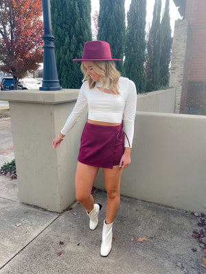 Skort features a solid base color, soft suede material, mini length, tie waist detail, front overlay detail and runs true to size!-burgundy 