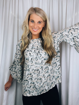 Top features a beige, grey and dusty blue abstract print, 3/4 ruffle sleeves, light weight material, round neck line and runs true to size!   * We recommend only wearing  nude undergarments & hang to dry 