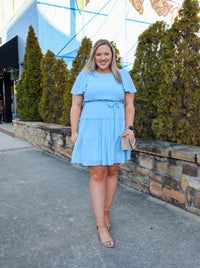 Dress features a stunning powder blue color, solid butterfly sleeve, ruffle tiered skirt, side pockets, round neck line, and runs true to size! 