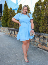 Dress features a stunning powder blue color, solid butterfly sleeve, ruffle tiered skirt, side pockets, round neck line, and runs true to size! 