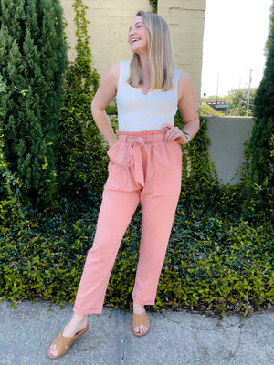 Pants feature a solid base color, wide leg fit, pockets, front tie detail and runs true to size!-blush