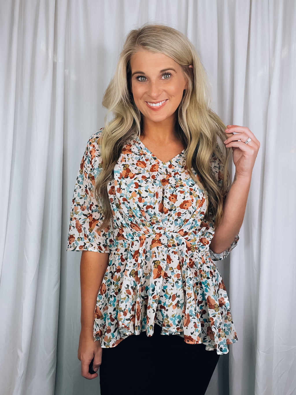 Top features a light base, multi color floral print, short kimono sleeves, V-neck line and runs true to size!   *Is a tad sheer so we recommend wearing only a nude bra* 