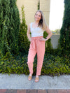 Pants feature a solid base color, wide leg fit, pockets, front tie detail and runs true to size!-blush