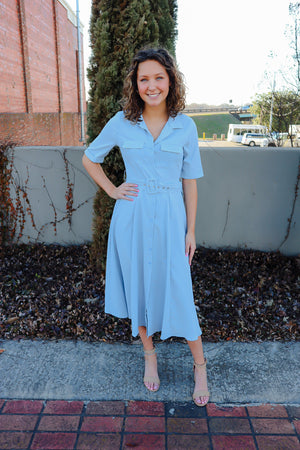 Dress features a pale blue color, short sleeves, belt detail, collar detail, button down, midi length, and runs true to size! 