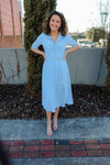 Dress features a pale blue color, short sleeves, belt detail, collar detail, button down, midi length, and runs true to size! 