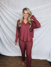 This lounge set features a solid base color, soft material, top with a V-neck line and long sleeves, jogger high waisted pants, surplus pockets with a drawstring and runs true to size!-MARASLA