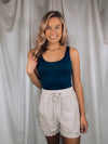 Bodysuit features a simple and flattering scoop neck with a soft, stretchy material.-navy