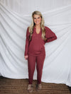 This lounge set features a solid base color, soft material, top with a V-neck line and long sleeves, jogger high waisted pants, surplus pockets with a drawstring and runs true to size!-MARSALA