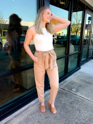 Pants feature a solid base color, wide leg fit, pockets, front tie detail and runs true to size!-taupe