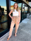 Pants feature a solid base color, wide leg fit, pockets, front tie detail and runs true to size!-taupe