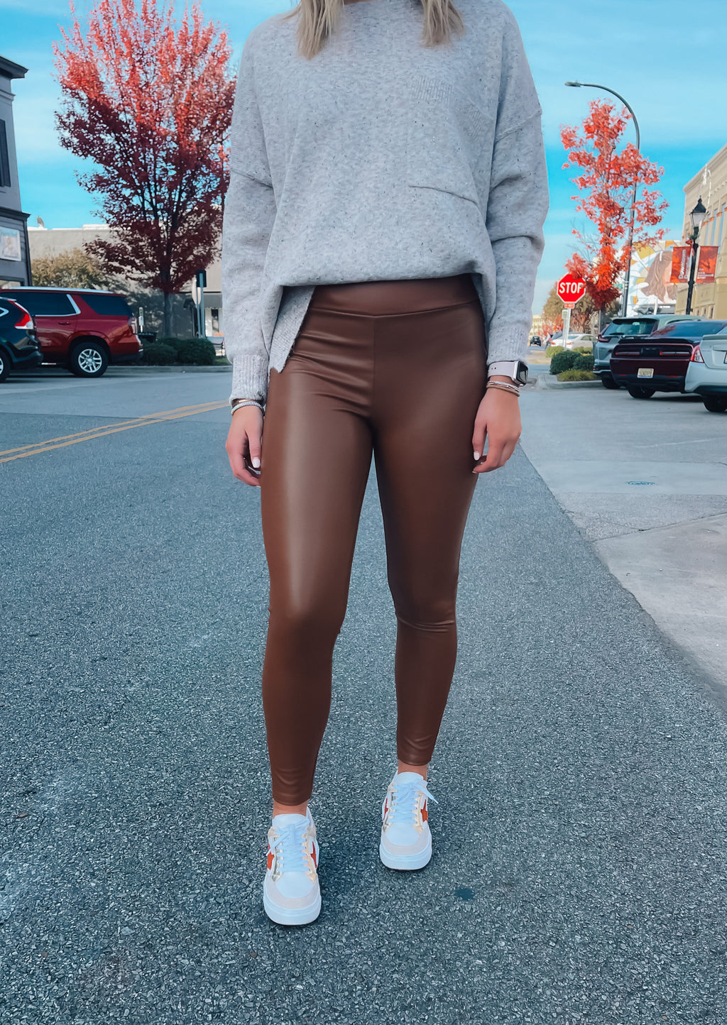 Bottoms feature a solid base color, pleather material, high waisted detail, fitted fit, pull on detail and runs true to size!-brown