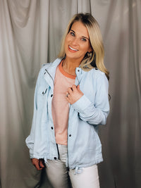 Jacket features a chambray color, hidden zip front, snap button front, roll tab sleeves, long sleeves and runs true to size! 