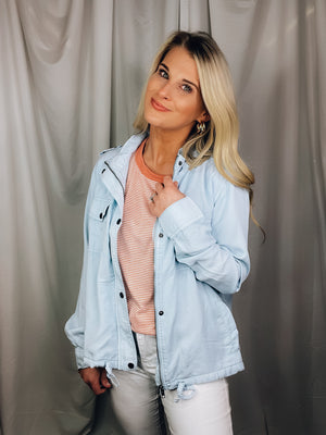 Jacket features a chambray color, hidden zip front, snap button front, roll tab sleeves, long sleeves and runs true to size! 
