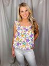 Top features an ivory base, multi colored floral print, ruffle straps, elastic chest, light weight material and runs true to size!   Materials:  100% Polyester 