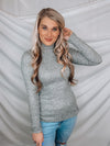 Top features a solid base color, high neck line, fitted fit, long sleeves and runs true to size!-GREY