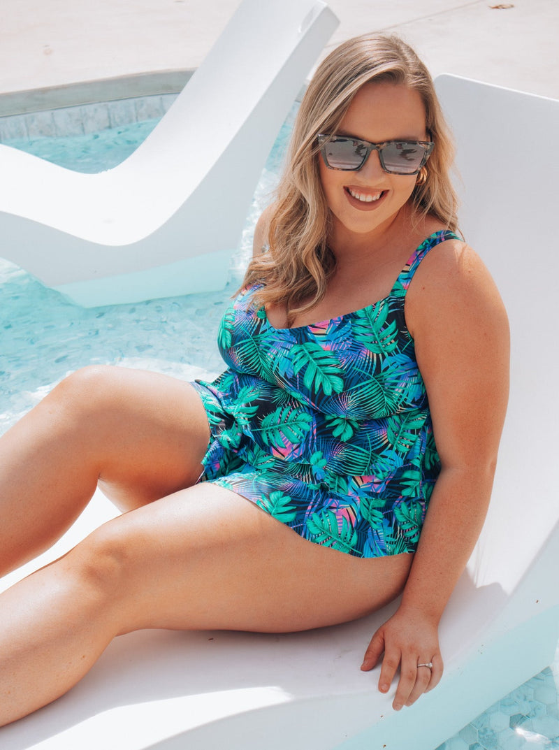 Say aloha to your new favorite one piece! Slip into our Tropical Bliss swimsuit and feel the perfect balance of bright and bold vibes. With adjustable straps and full coverage bottoms, you'll rock the beach scene with confidence and style. And don't worry - this design is flattering, not flabbergasting!