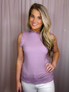 Hopeful Moments Top offers a round neckline and ribbed material for a comfortable and fitted fit. It also features a sleeveless detail and ruffle hemline for a flattering silhouette. With its precise design and breathable material, this top will keep you looking and feeling your best.-lavender