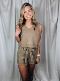 Set offers a solid base color, sleeveless detail, tank and short pieces, frayed lining detail, pockets, tie belt, with a textured look to add the perfect amount of detail. Runs true to size!-MOCHA