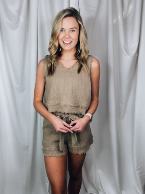 Set offers a solid base color, sleeveless detail, tank and short pieces, frayed lining detail, pockets, tie belt, with a textured look to add the perfect amount of detail. Runs true to size!-MOCHA