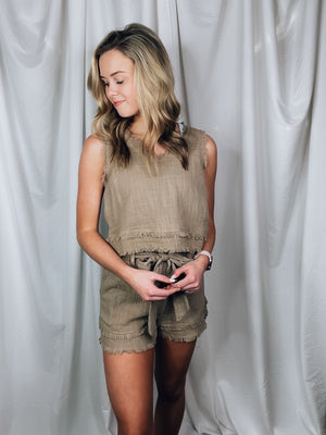 Set offers a solid base color, sleeveless detail, tank and short pieces, frayed lining detail, pockets, tie belt, with a textured look to add the perfect amount of detail. Runs true to size!-MOCHA