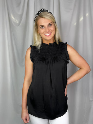 Top features a solid base color, sleeveless detail, smocked detail, ruffle detailing and runs true to size! -back