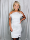 Dress features a solid base color, mini length, fitted fit, sleeveless detail, feathered detailing and runs true to size! -whie