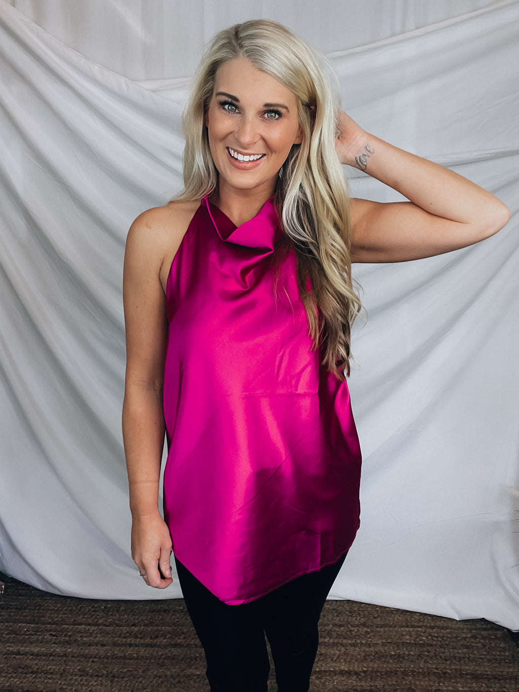 Top features a silky material, halter button closure neck line, sleeveless detail, backless detail, slight cowl neck and runs true to size!-MAGENTA