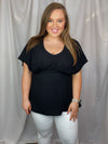 Top features a solid base color, V-neck line, dolman sleeves, pleated detailing and runs true to size!-black