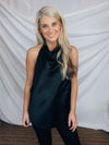 Top features a silky material, halter button closure neck line, sleeveless detail, backless detail, slight cowl neck and runs true to size!-BLACK