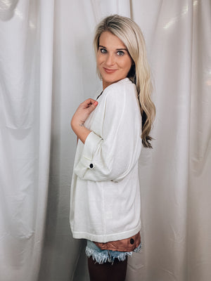 Cardigan offers a quarter sleeve, button detail, open front, sleeves and runs true to size!-ivory