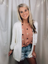 Cardigan offers a quarter sleeve, button detail, open front, sleeves and runs true to size!-ivory