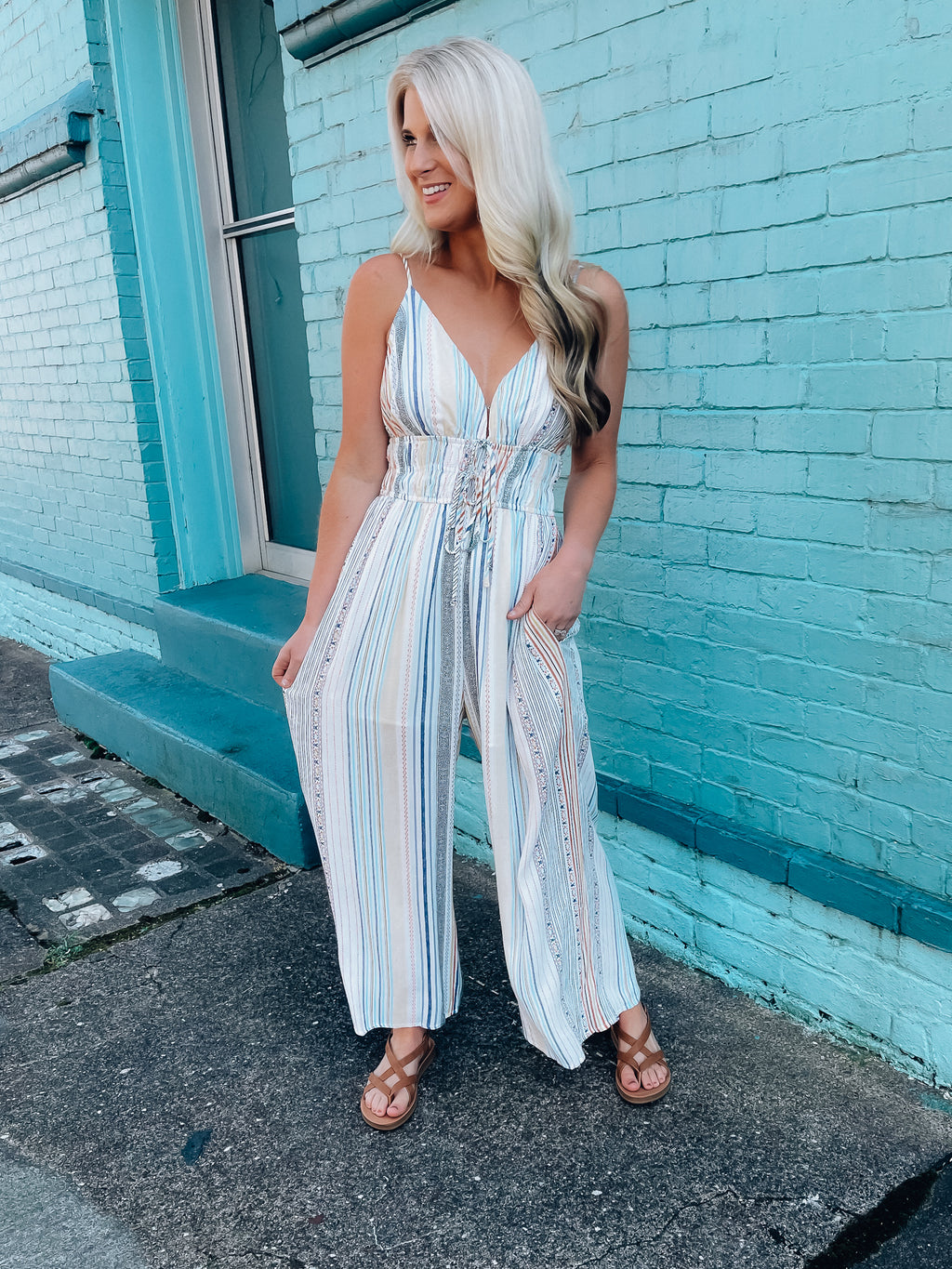 Jumpsuit features a multi color striped print, long pants, basic top, thin stripes, flattering fit and runs true to size! 