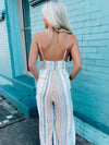 Jumpsuit features a multi color striped print, long pants, basic top, thin stripes, flattering fit and runs true to size! 