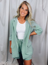 Linen Blazer features a 3/4 roll-sleeve, a base color with a functioning front button and collar detail, lined in gingham fabric. Fits true to size!-sage