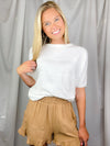 Top features an off white solid base color, short dolman sleeves, round neck line, soft materials, and runs true to size! 