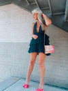 Tulle dress features a base color with a deep V cut-out, adjustable tie detail around the neck, and elastic waistband with an open back. Runs true to size!-black