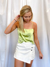 Skirt features a pretty white color, mini length, split detail, button front detail and runs true to size! 