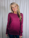 Top features a solid base color, long sleeves, horizontal line detailing, crew neck line and runs true to size!-magenta