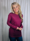 Top features a solid base color, long sleeves, horizontal line detailing, crew neck line and runs true to size!-magenta