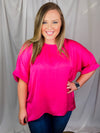 Top features a soft silk material, round neck line, short sleeves, oversized fit and runs true to size!-magenta