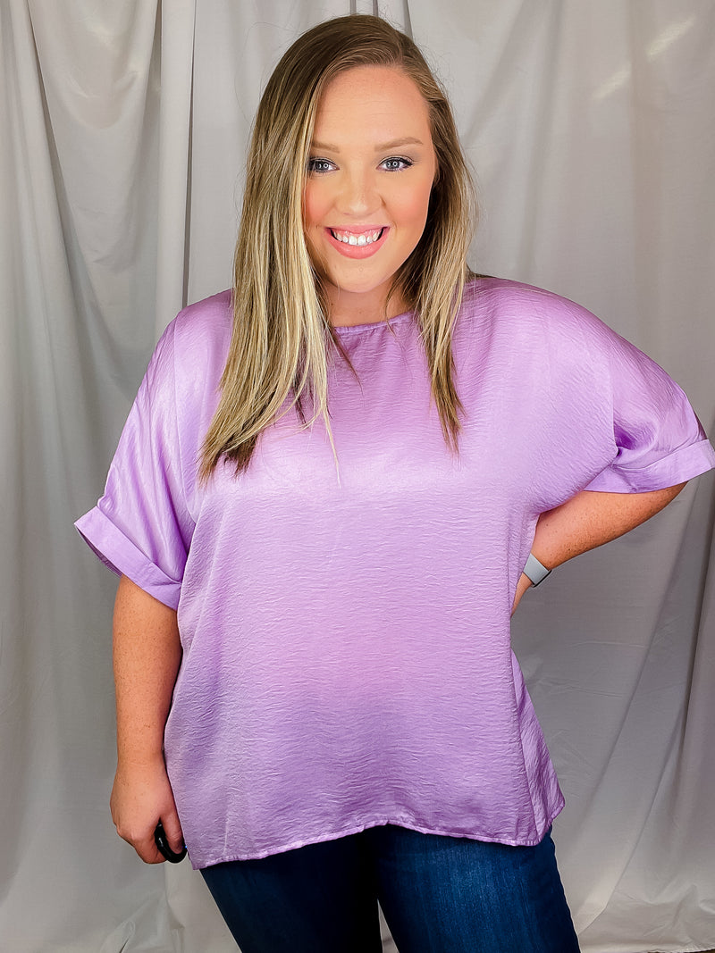 Top features a soft silk material, round neck line, short sleeves, oversized fit and runs true to size!-lavender