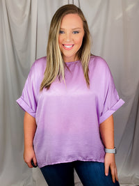 Top features a soft silk material, round neck line, short sleeves, oversized fit and runs true to size!-lavender