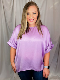 Top features a soft silk material, round neck line, short sleeves, oversized fit and runs true to size!-lavender