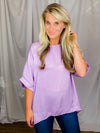 Top features a soft silk material, round neck line, short sleeves, oversized fit and runs true to size!-lavender